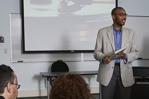 Teacher presenting in front of a class