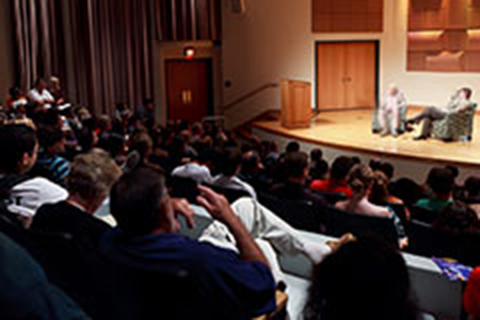 An audience observing a stage